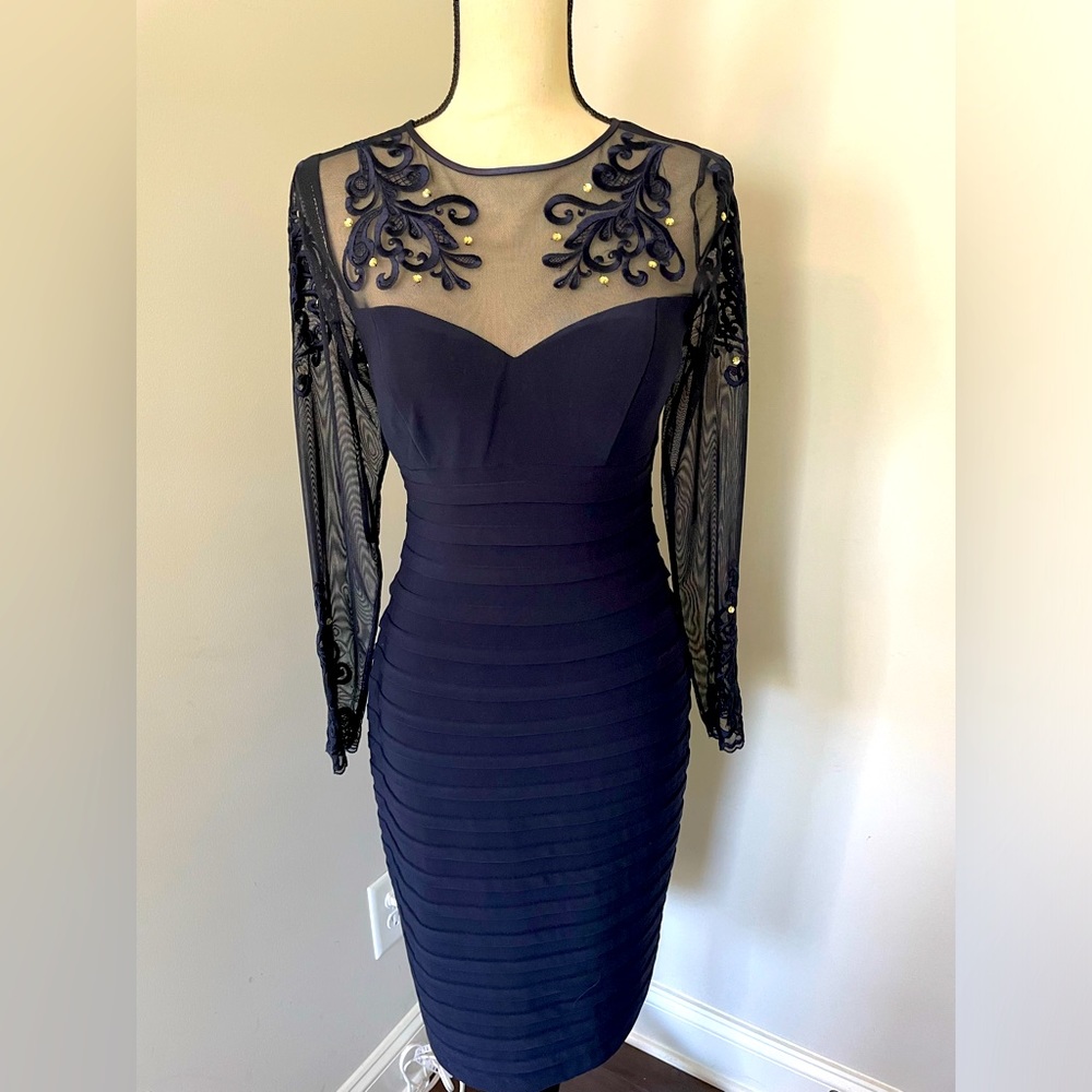 Lovely navy blue cocktail dress. Worn once. Size 6. Great, classic piece!